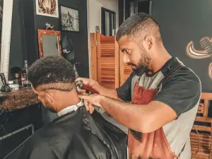 Two men doing a hair cut 