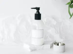 Shampoo bottle on white table