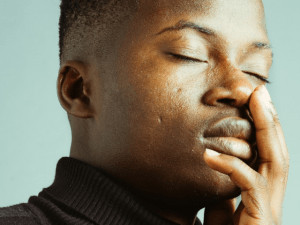 Young black man wearing black trousers