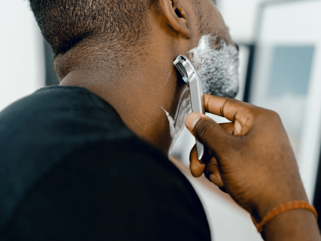 Black man shaving