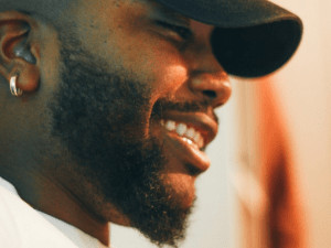 black man with cap