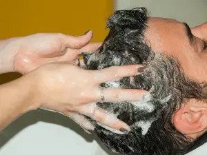 Man getting washed his hair