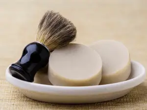 handmade shaving soap and brush in a plate