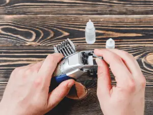 cleaning of electric razor on a wooden table