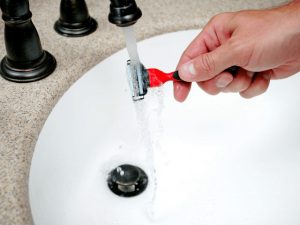 man cleaning a razor