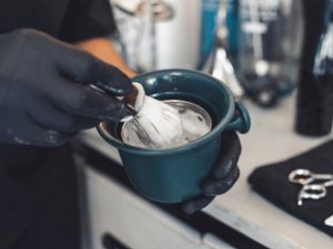 barber preparing a shaving cream