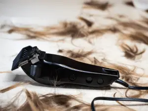 hair clipper with hairs on the floor