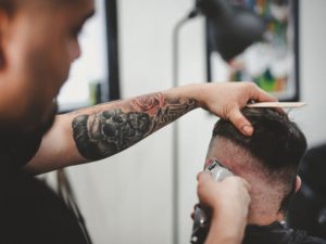 man holding a clipper for hair cut