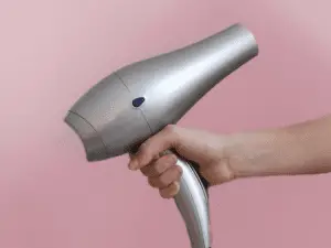 woman holding a hair dryer