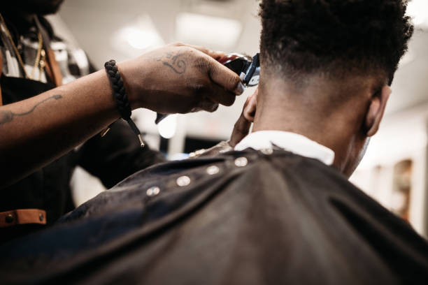 barber-giving-a-haircut-in-his-shop