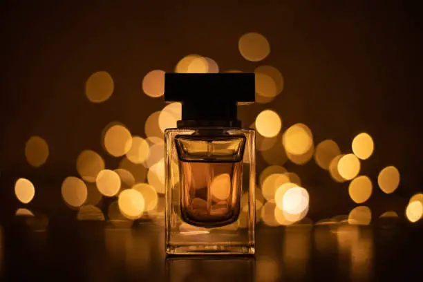 perfume-bottle-on-bokeh-lights-background