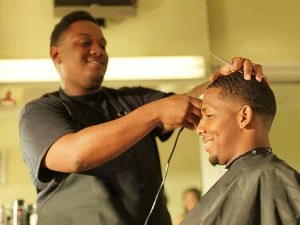 Barber giving a customer a trim